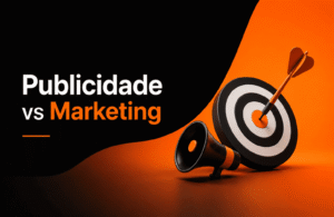 Banner com fundo preto e laranja mostrando um alvo com dardo e megafone ao lado da frase “Publicidade vs Marketing”.